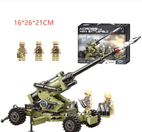 A set of small, green colored building blocks designed to replicate a military cannon, including figures to operate the cannon, and the product packaging box.