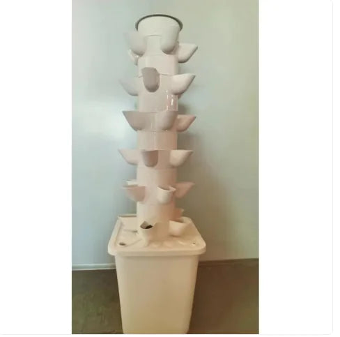 A white vegetable planting machine with plant lamp, featuring multiple holes for planting, placed on a square base.