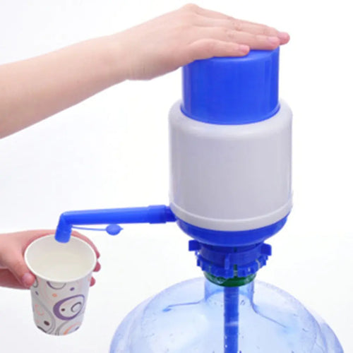 A water pressure pump in blue and white colors attached to a large blue bottle, with a person's hand using a cup to collect water.