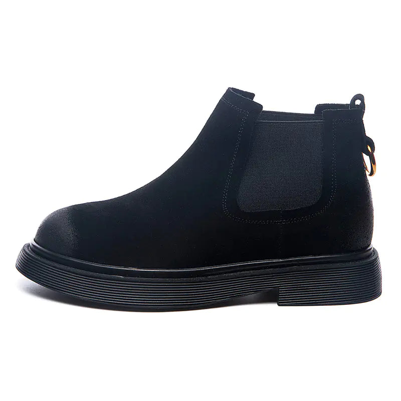 A black leather chunky ankle boot with a side zipper and a flat sole.