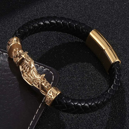 A woven leather motorcycle bracelet with gold stainless steel accents, displayed on a dark background.