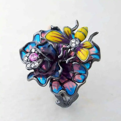 Bee Landing on Peacock Colored Flower WEM Support (www.WEM.support)