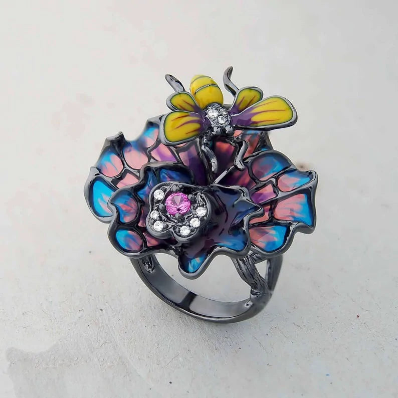 Bee Landing on Peacock Colored Flower WEM Support (www.WEM.support)