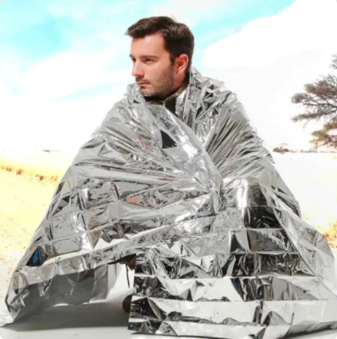 Human Body Hypothermia Lifesaving Emergency Blanket In Outdoor Field WEM Support (www.WEM.support)